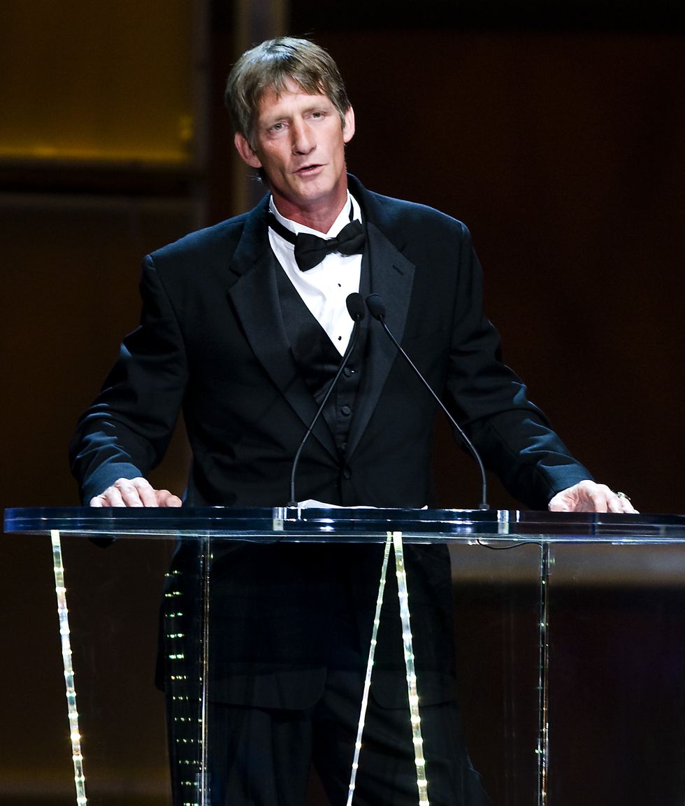 kevin von erich wearing a tuxedo and speaking at a podium