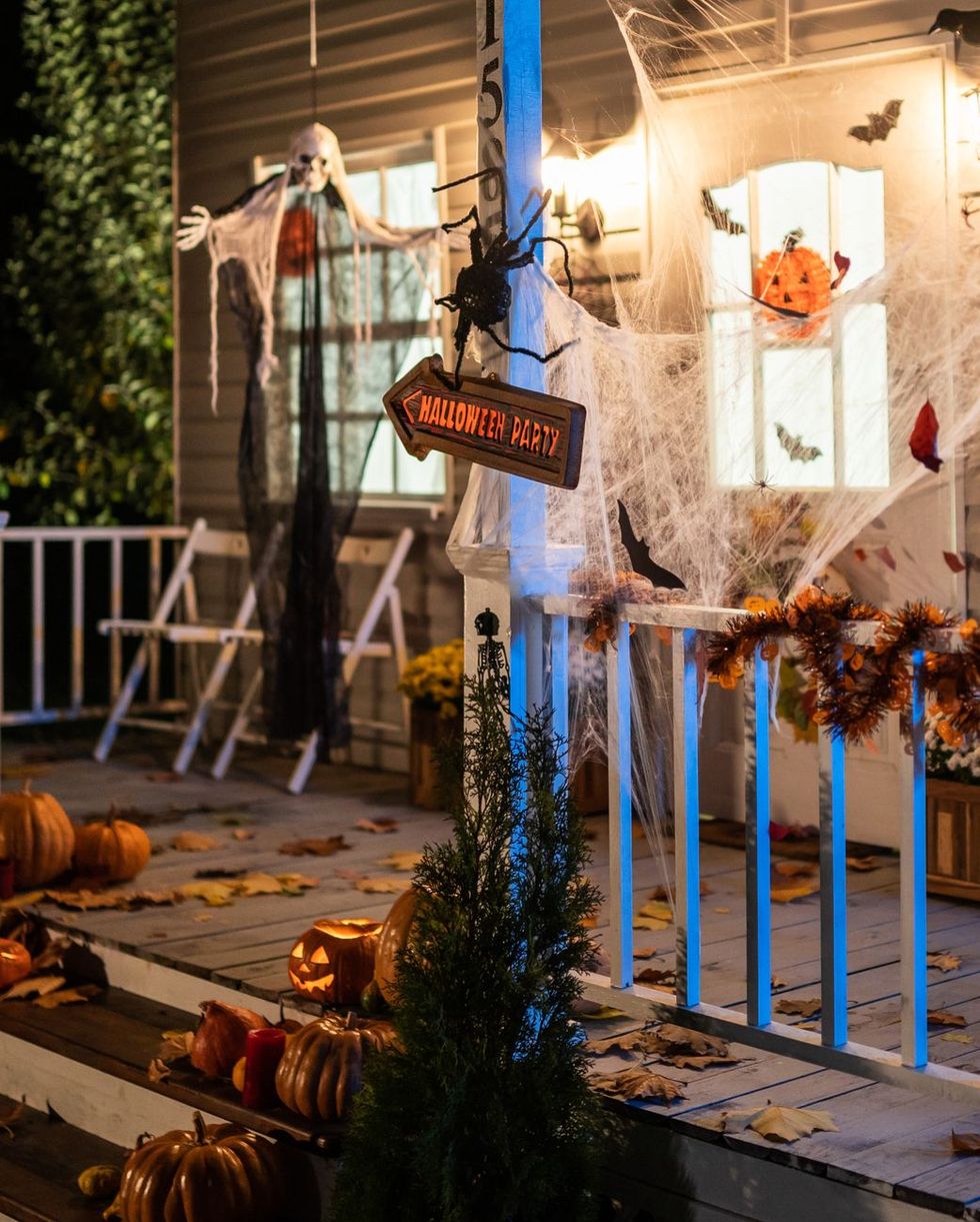 halloween jack o lantern pumpkins on a porch stairs