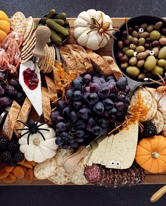 halloween charcuterie board with grapes and spiders