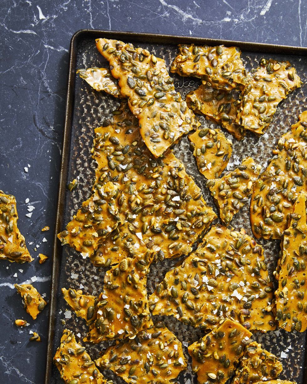 rosemary pumpkin seed brittle on a baking tray