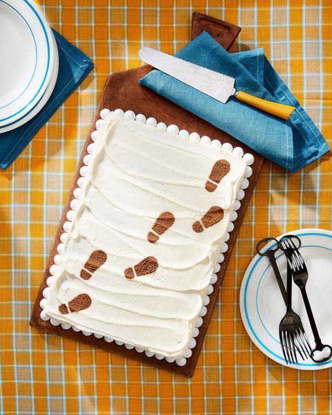 malted sheet cake with footprints on it