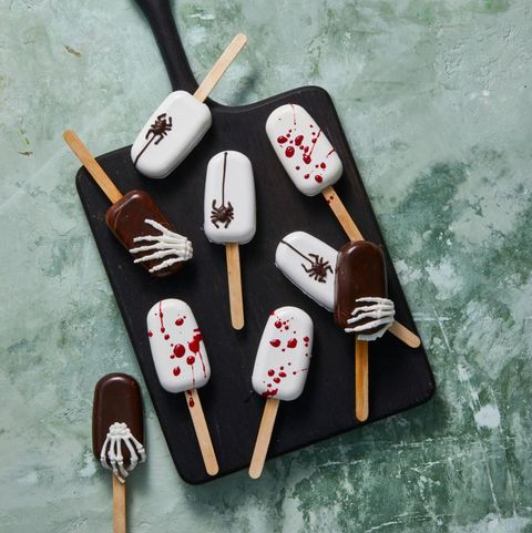 cake pops with blood, spiders, and skeleton hands