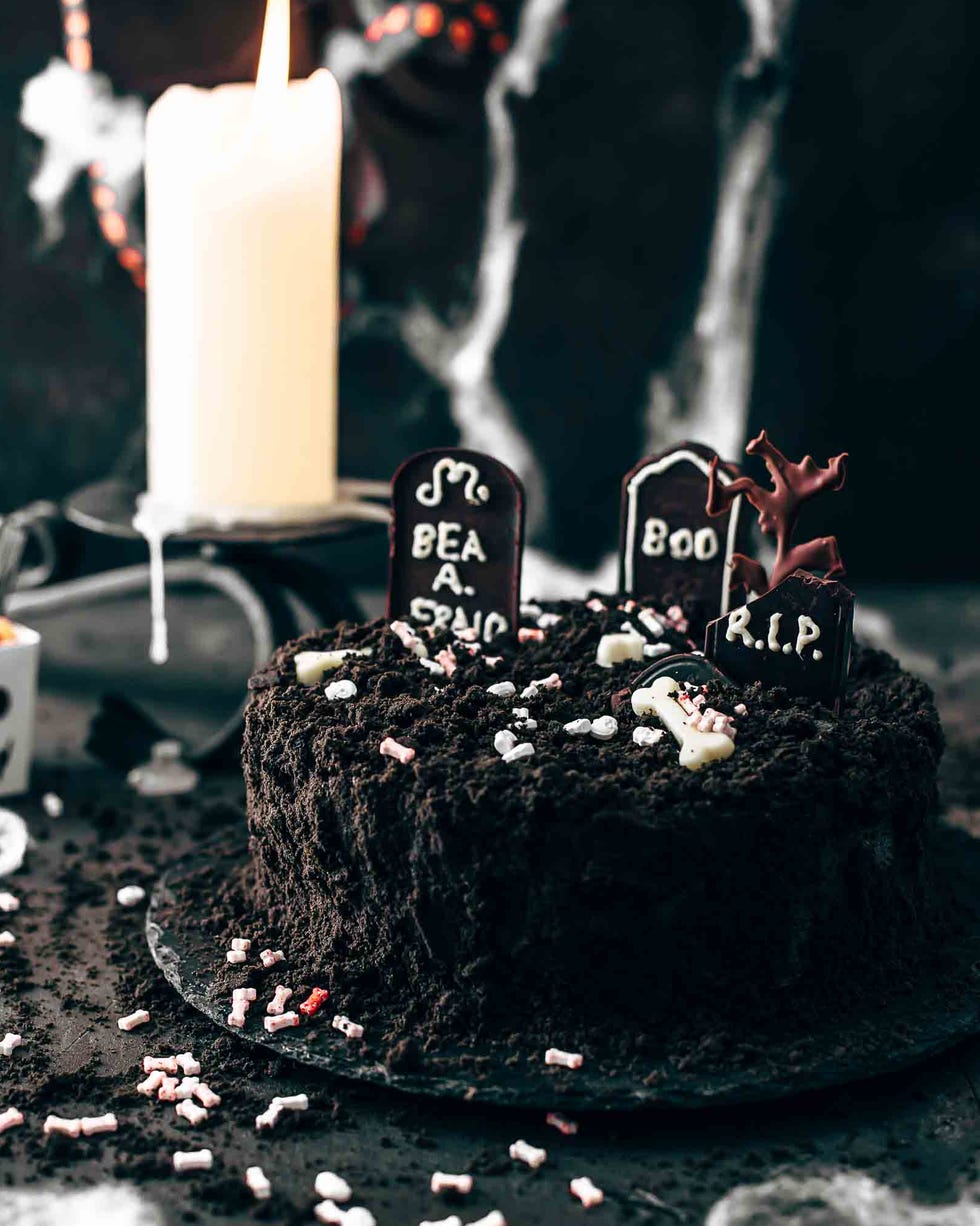 death by chocolate cake with candle and spider web decor