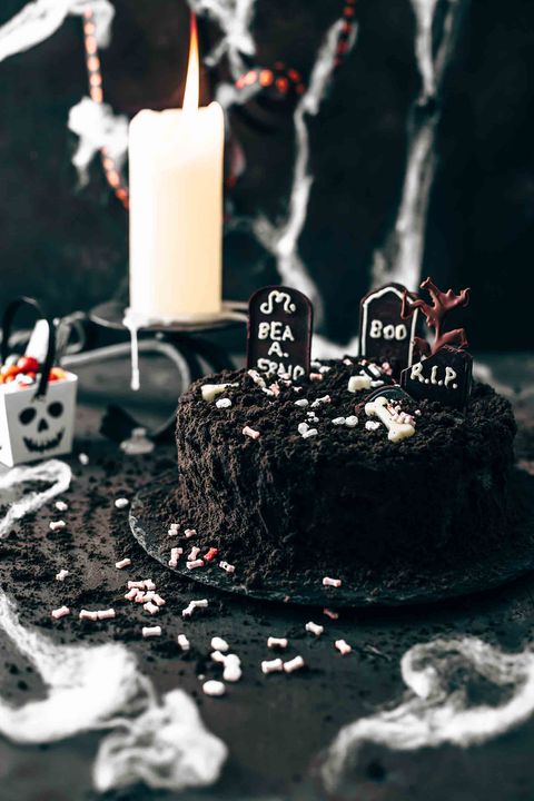 death by chocolate cake with candle and spider web decor