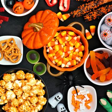 halloween candy buffet table top view over a black background