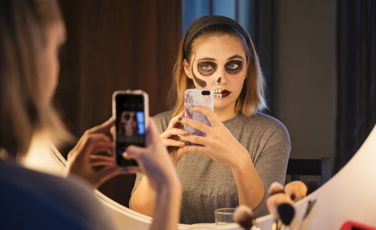 halloween captions woman wearing zombie makeup