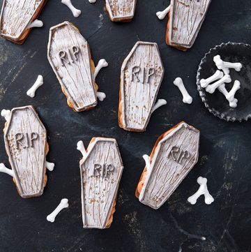 coffin shaped sandwich cookies with candy bones poking out