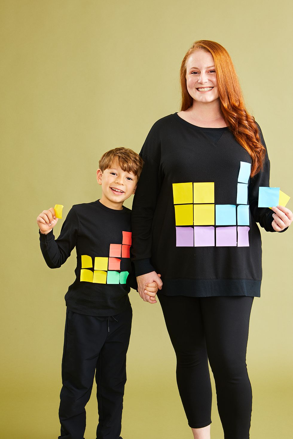 a mom and son wear diy tetris halloween costumes made from black clothes and colored postits