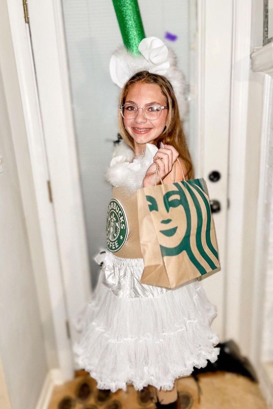 tween girl wearing homemade starbucks cup costume for halloween