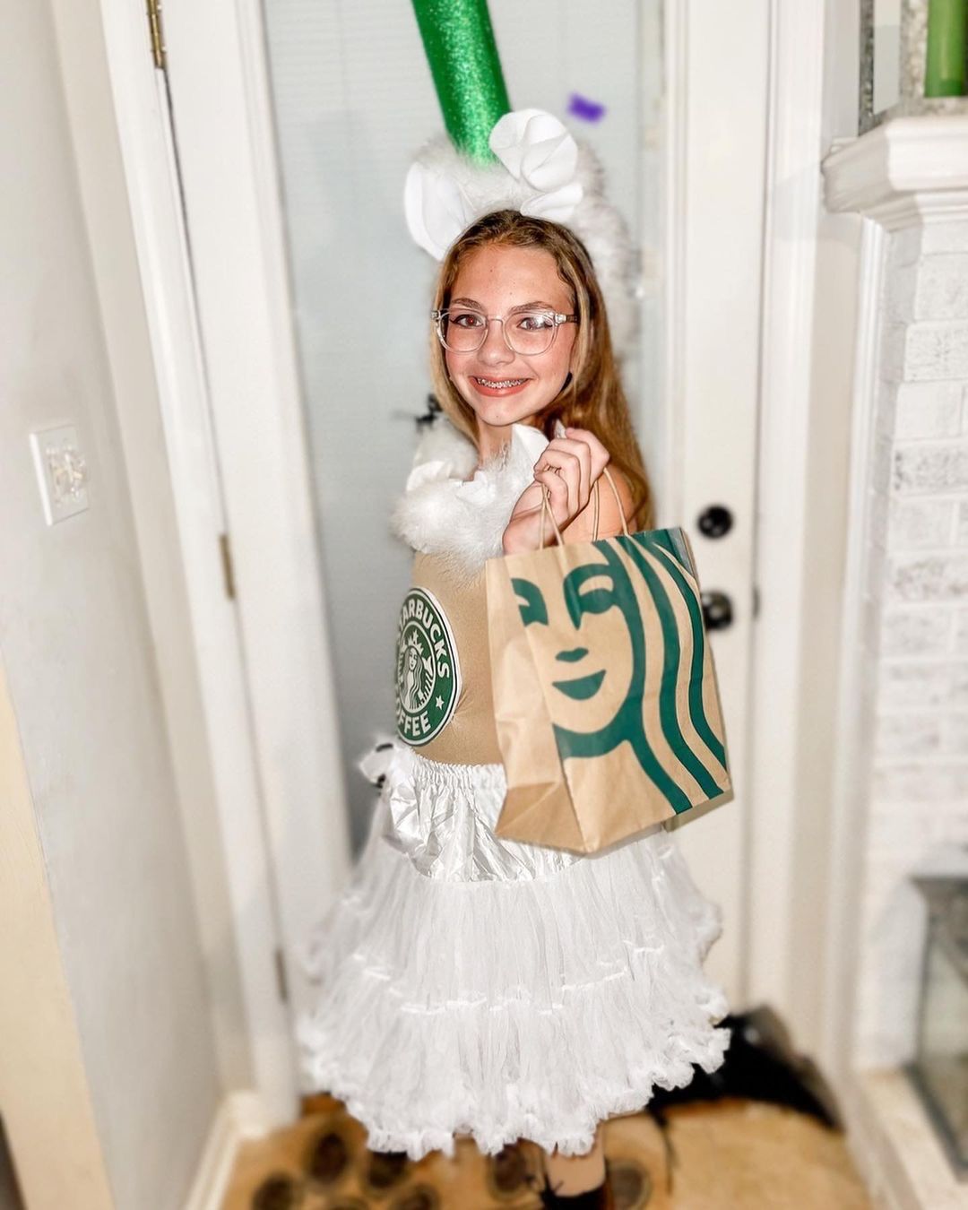 tween girl wearing homemade starbucks cup costume for halloween