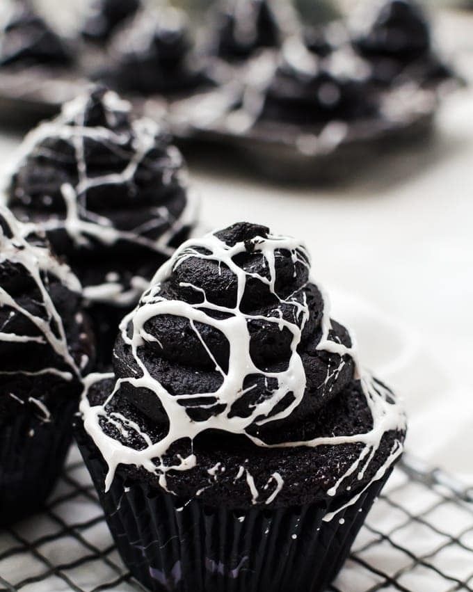 spider web cupcakes on wire rack