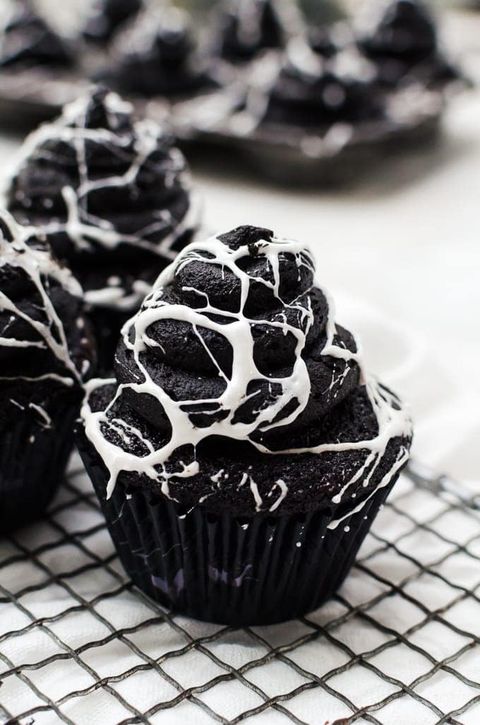 spider web cupcakes on wire rack