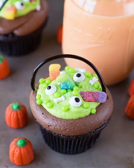 witches cauldron cupcakes with green frosting