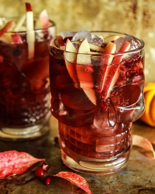 spiced apple cider pomegranate moscow mule in skeleton glass