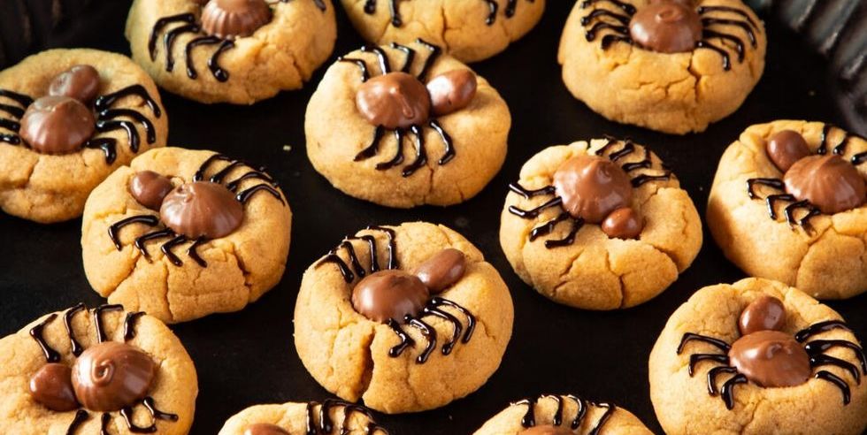 spider cookies on black plate