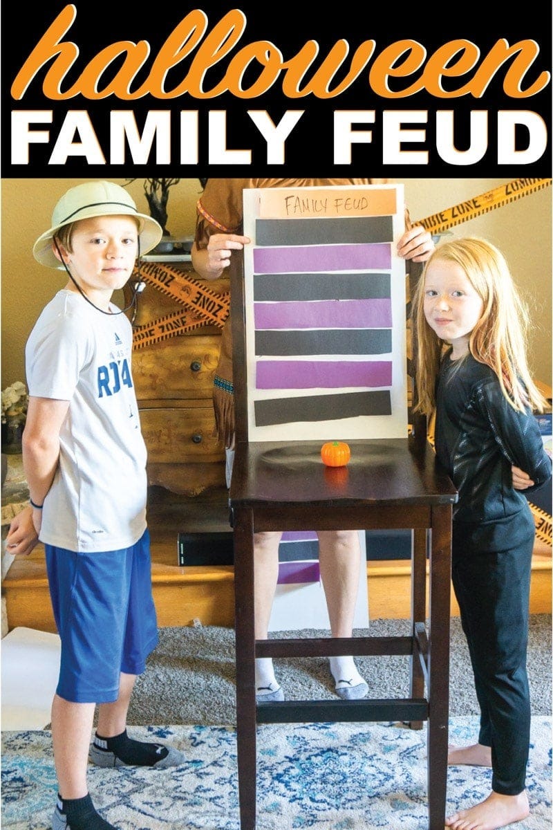 Halloween game, kids next to a chair with a sign that reads Family Feud