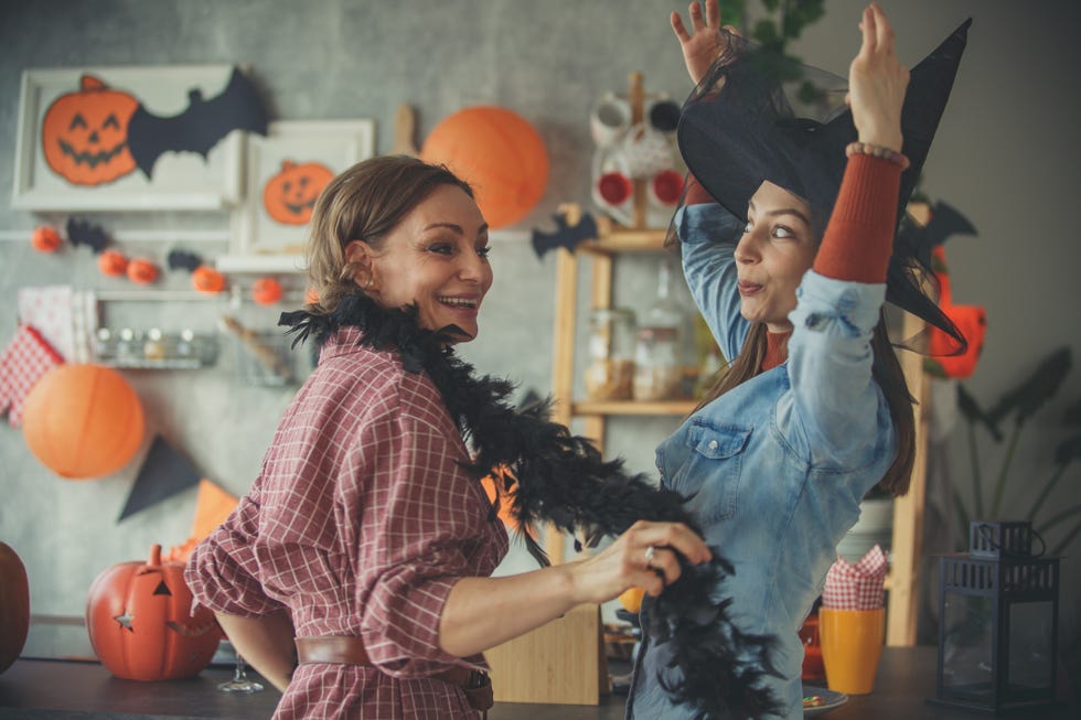 two women dancing in costumes