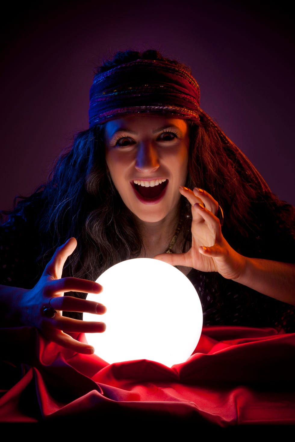 woman with a crystal ball in her hands