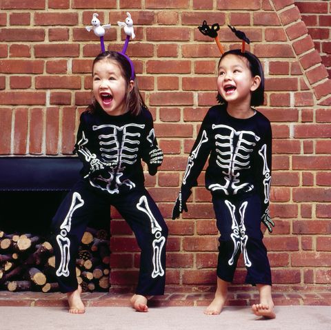 young girls in skeleton costumes