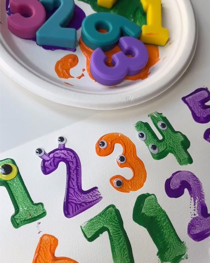 paint stamped block numbers decorated with googly eyes to look like monsters paint stamped block numbers decorated with googly eyes to look like monsters