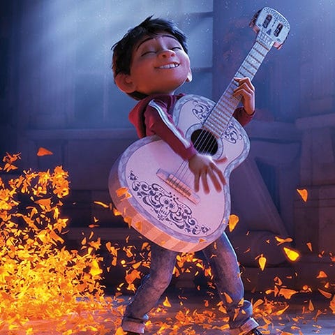 miguel plays a magic guitar in a scene from 'coco,' a good housekeeping pick for best halloween movies for kids
