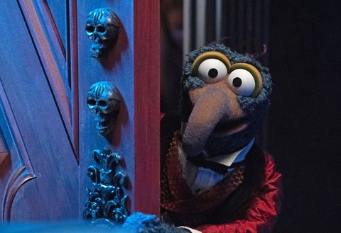 gonzo opens a spooky door in 'muppets haunted mansion,' a good housekeeping pick for best halloween movies for kids