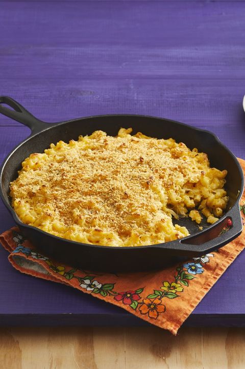 butternut squash mac and cheese in cast iron skillet on purple background
