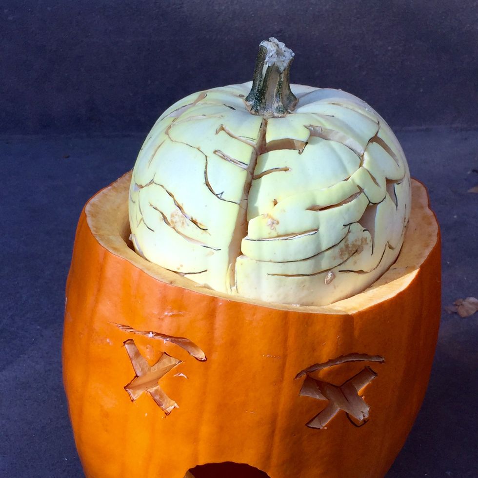 a halloween pumpkin with a brain