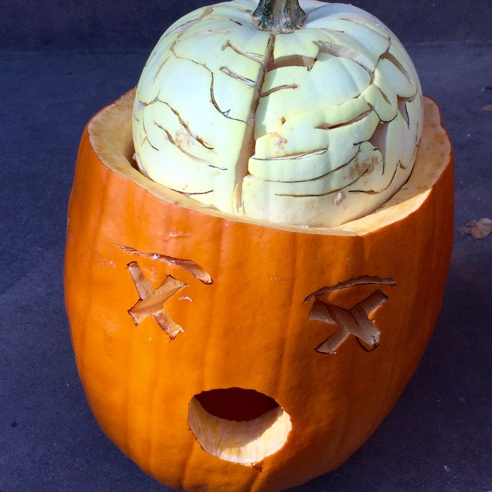 a halloween pumpkin with a brain