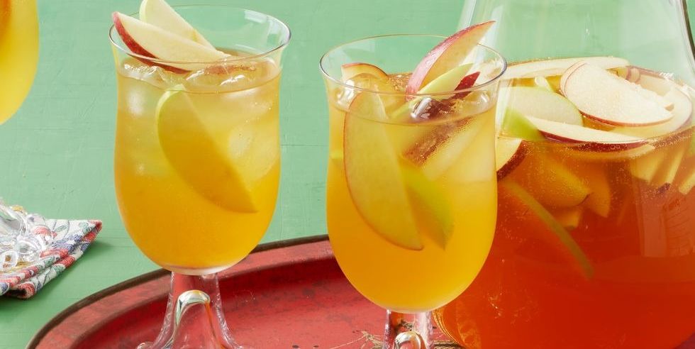 halloween punch recipes apple cider sangria in glasses and pitcher