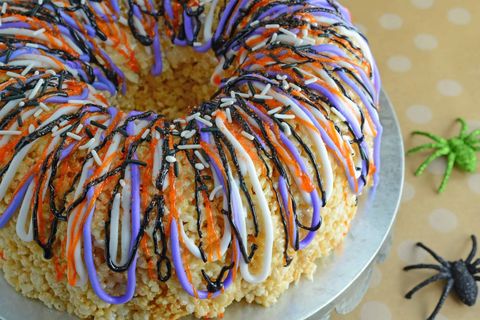 halloween rice krispies cake with purple and black drizzle