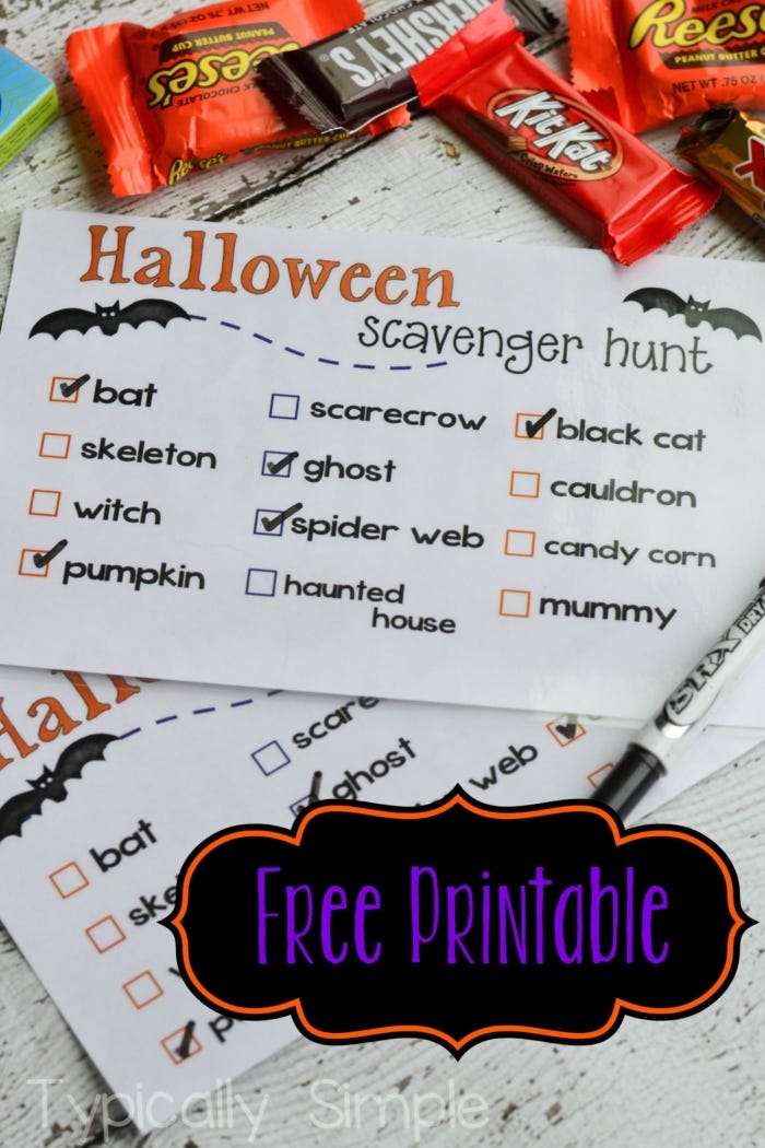 halloween games, printed scavenger hunt game for halloween on the table with candy bars