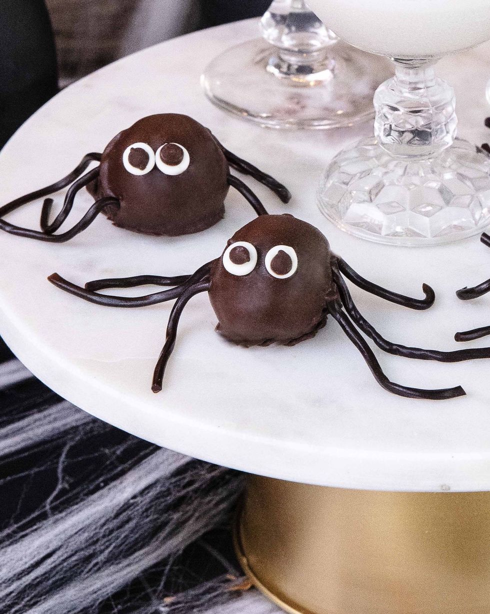 spider cookie truffles arranged on a cake stand