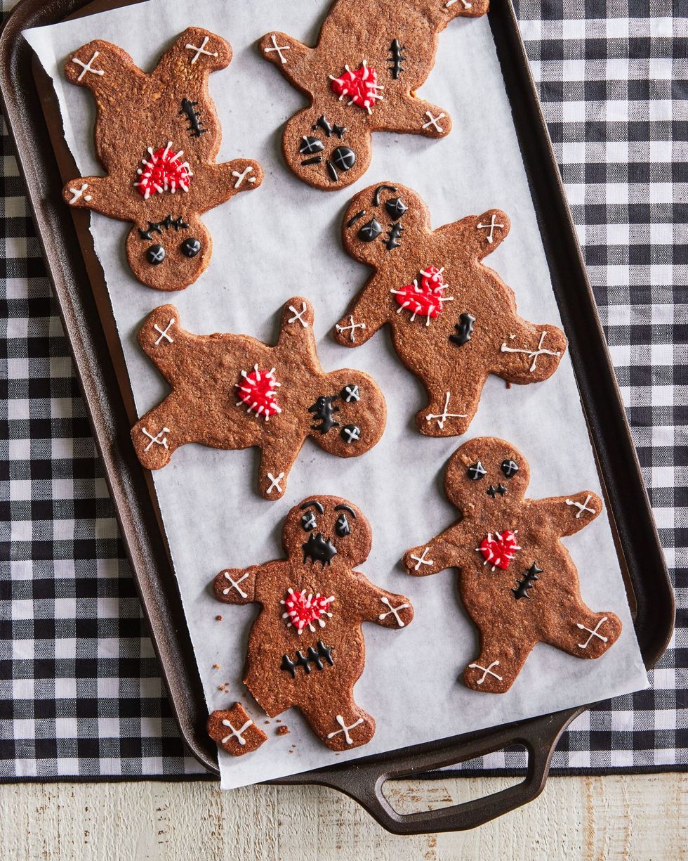 halloween voodoo gingerbread men on a parchment lined sheet tray