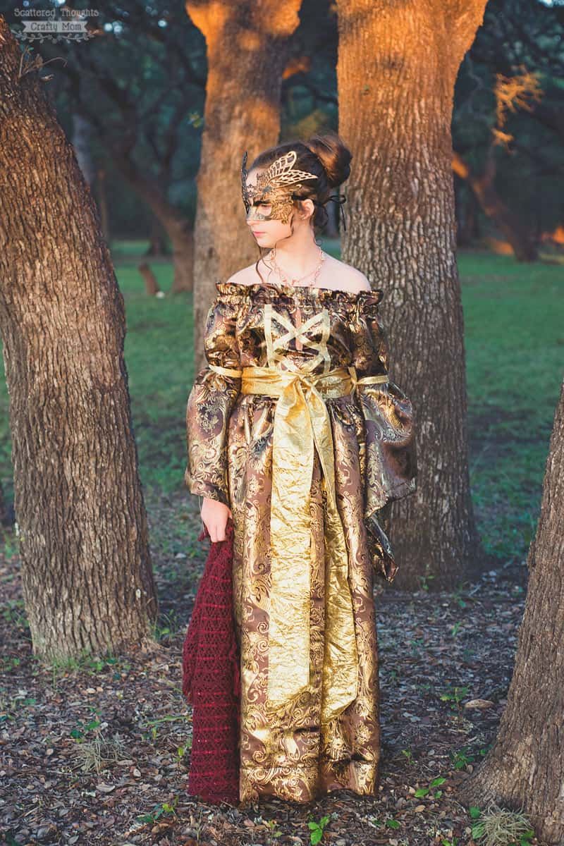 gold and bronze renaissance princess halloween costume for tween girl with off shoulder neckline and long skirt