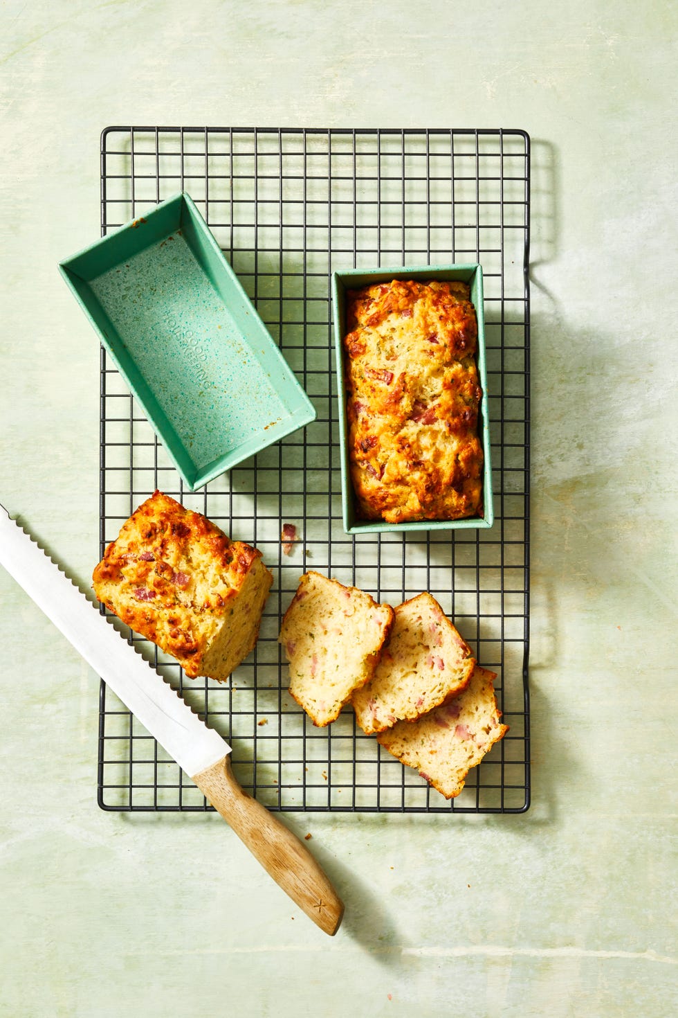 ham and cheese beer bread in a green loaf pan
