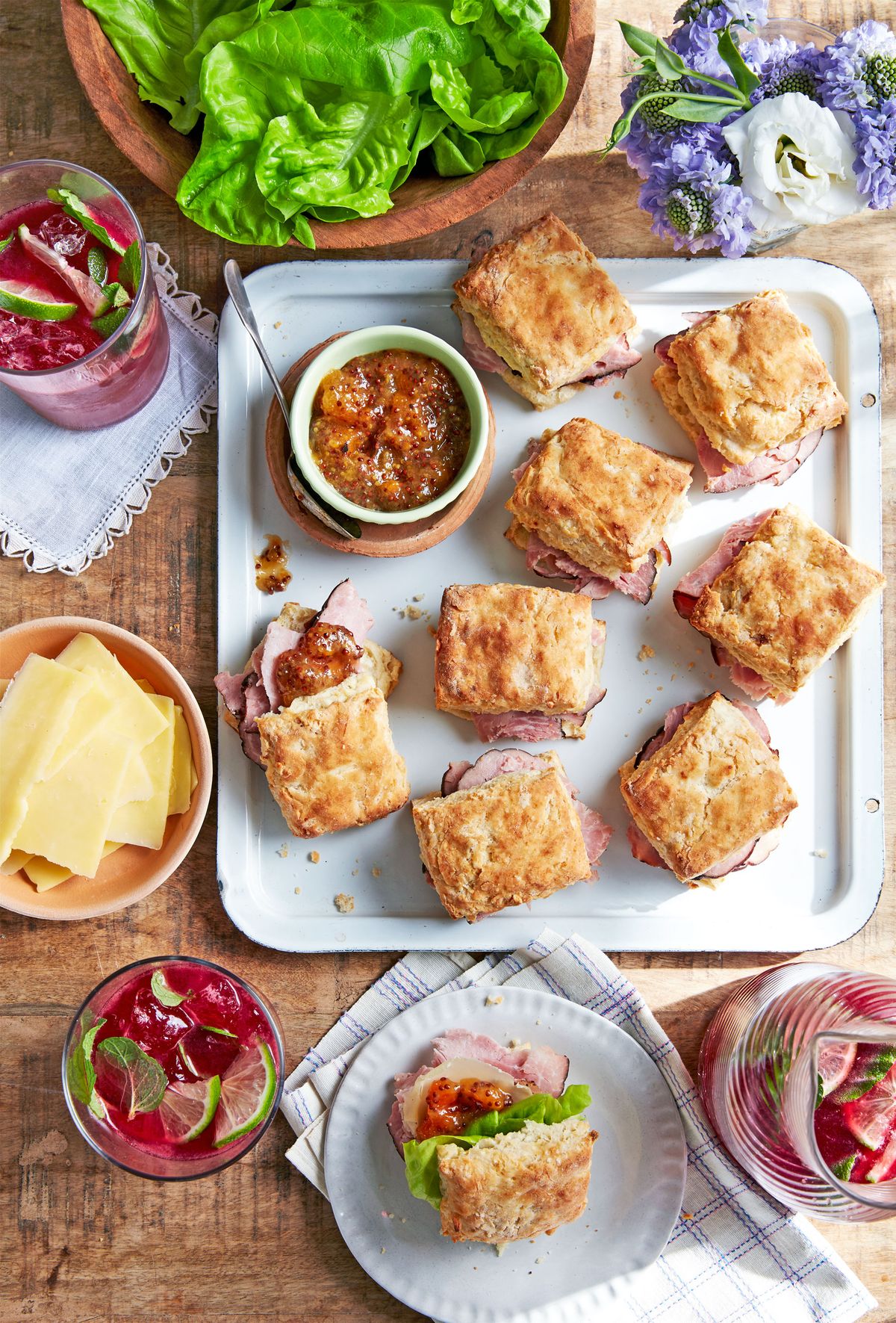 ham biscuit sandwiches with apricot mustard on a tray