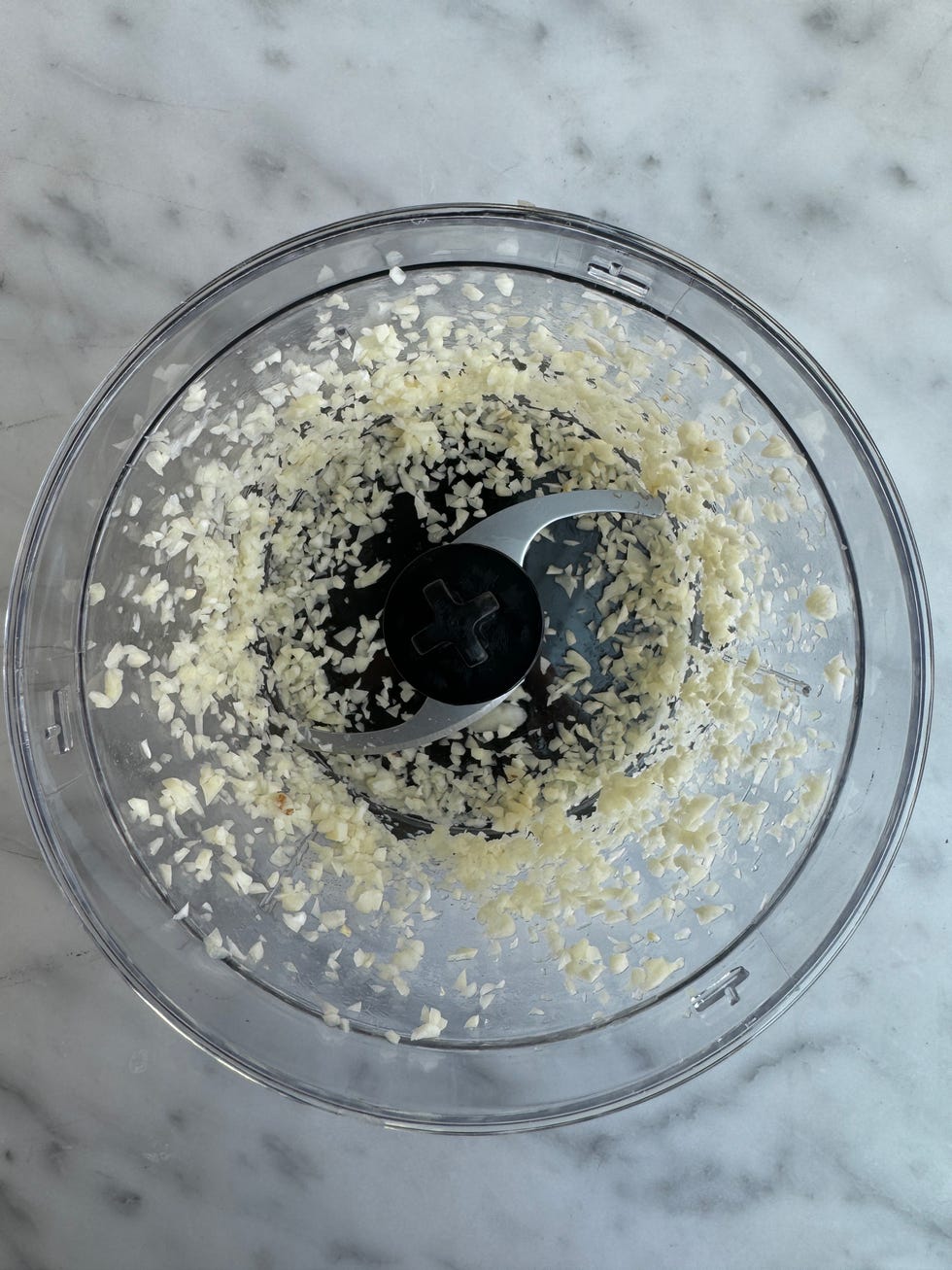 chopped garlic in a food processor bowl
