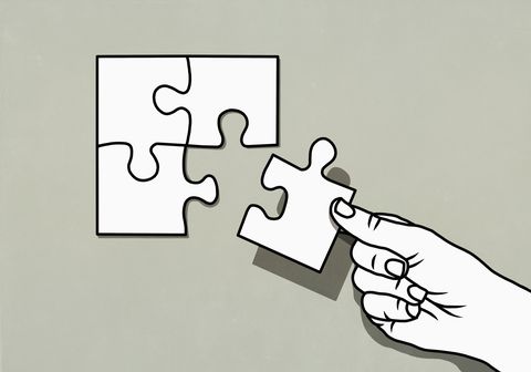 hand finishing jigsaw puzzle with missing piece