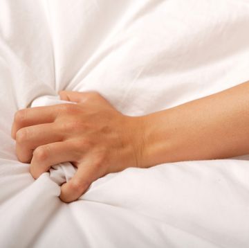 orgasm benefits hand grabbing sheet