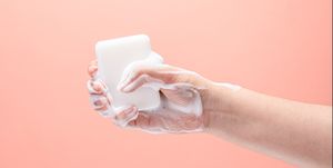 hand gripping a white soap