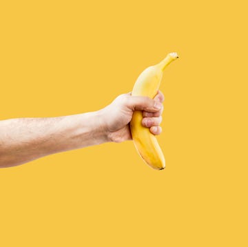 hand male holding a shape banana telephone