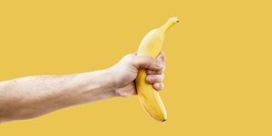 hand male holding a shape banana telephone