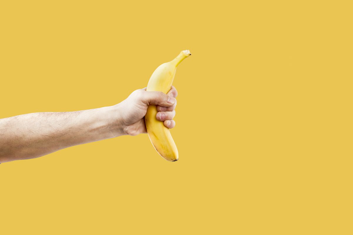 hand male holding a shape banana telephone