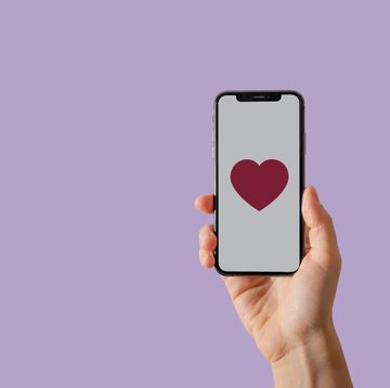hand with smartphone, heart on screen