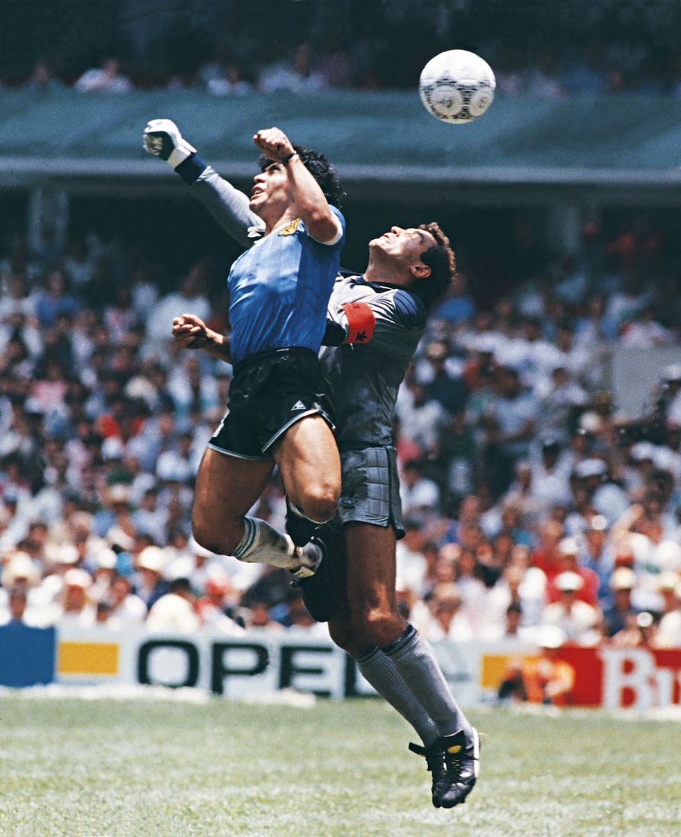mexico city, mexico   june 22 diego maradona of argentina uses his hand to score the first goal of his team during a 1986 fifa world cup quarter final match between argentina and england at azteca stadium on june 22, 1986 in mexico city, mexico maradona later claimed that the goal was scored by 'the hand of god' photo by archivo el graficogetty images