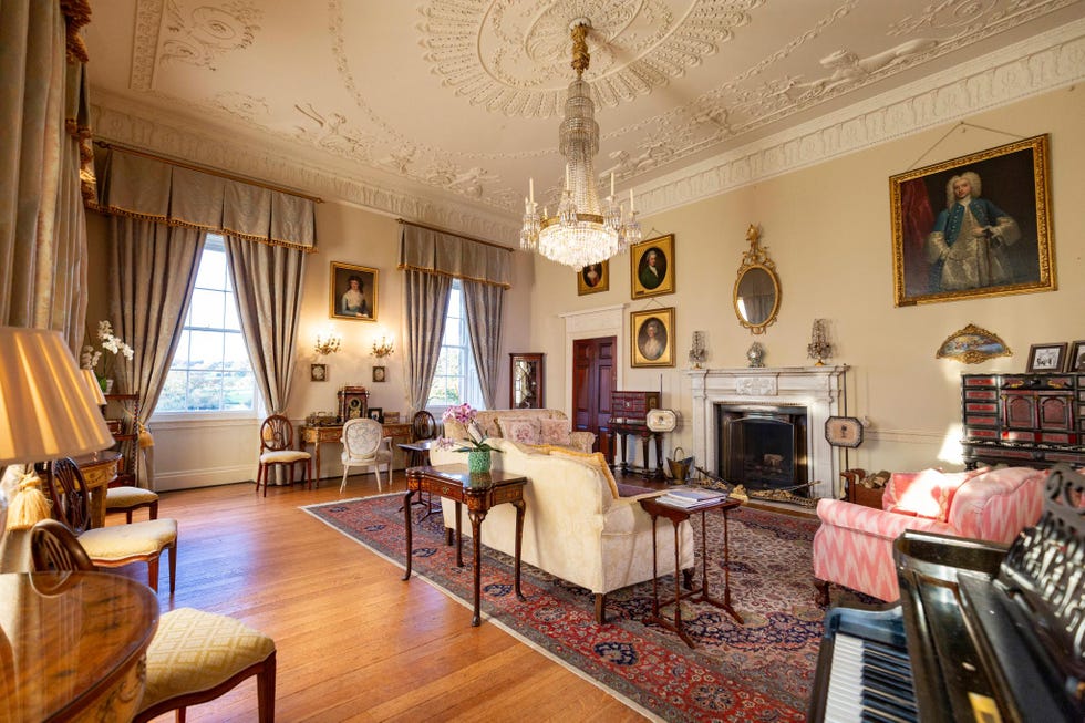 elegant sitting room with vintage furnishings and artistic decor