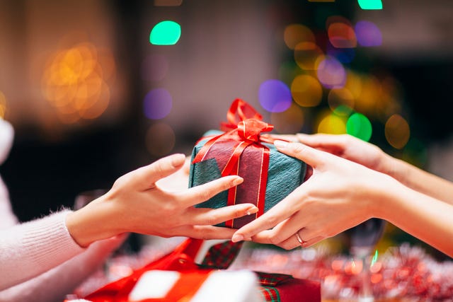 hands giving gift close up