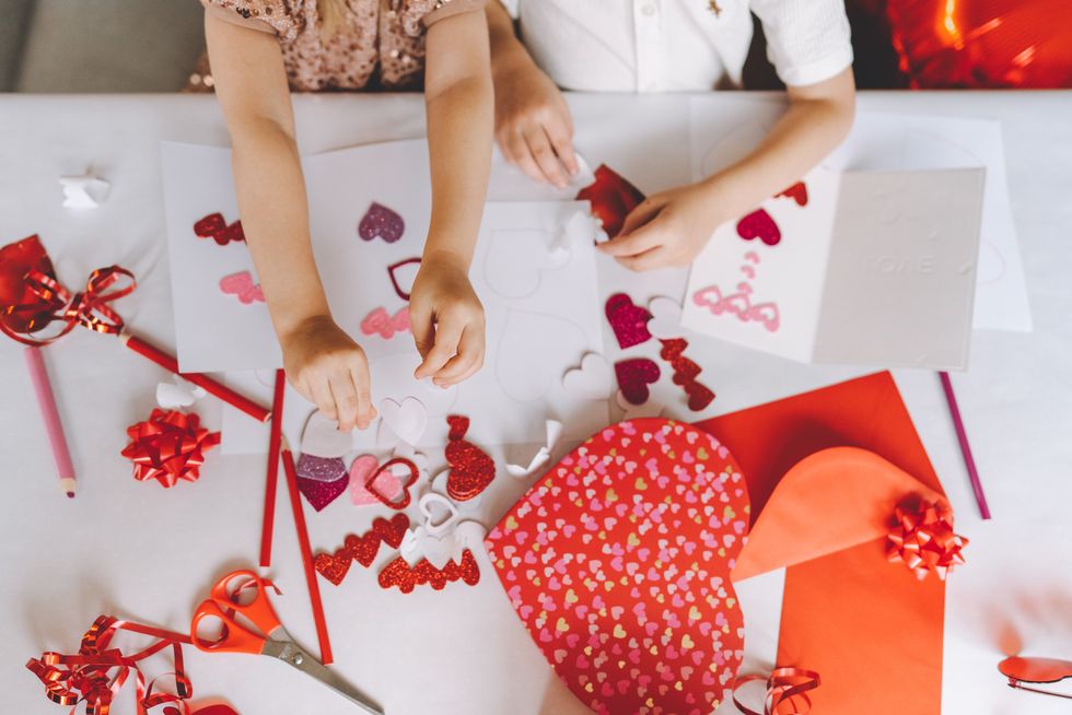 hands of two children making greeting cards