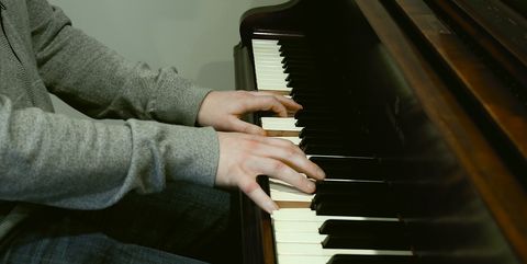 Steven Gutheinz plays piano in his home studio in Los Angeles